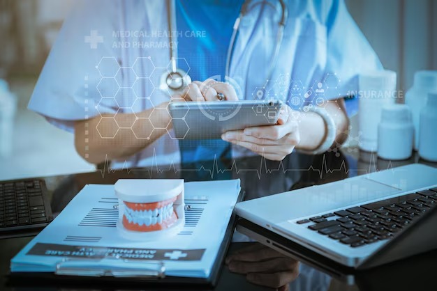 Dental office team reviewing digital billing dashboard and insurance claim data in 2026